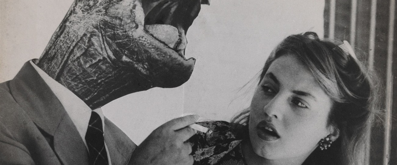 Fotomontaje de Grete Stern: un hombre de traje con cabeza de tortuga enciende el cigarrillo de una mujer que lo mira de costado.